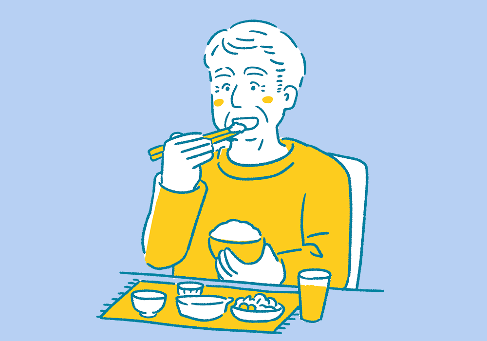 食事をとる高齢男性