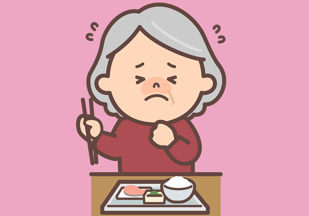 食事中にむせる女性